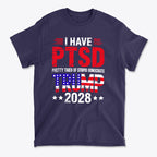 I Have PTSD Pretty Tired Of Stupid Democrats Trump 2028 graphic t-shirt in navy blue featuring patriotic colors.