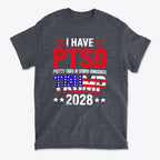 I Have PTSD Pretty Tired Of Stupid Democrats Trump 2028 graphic t-shirt in gray color with bold text.