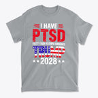 I Have PTSD Pretty Tired Of Stupid Democrats Trump 2028 graphic t-shirt in gray color with bold text design.