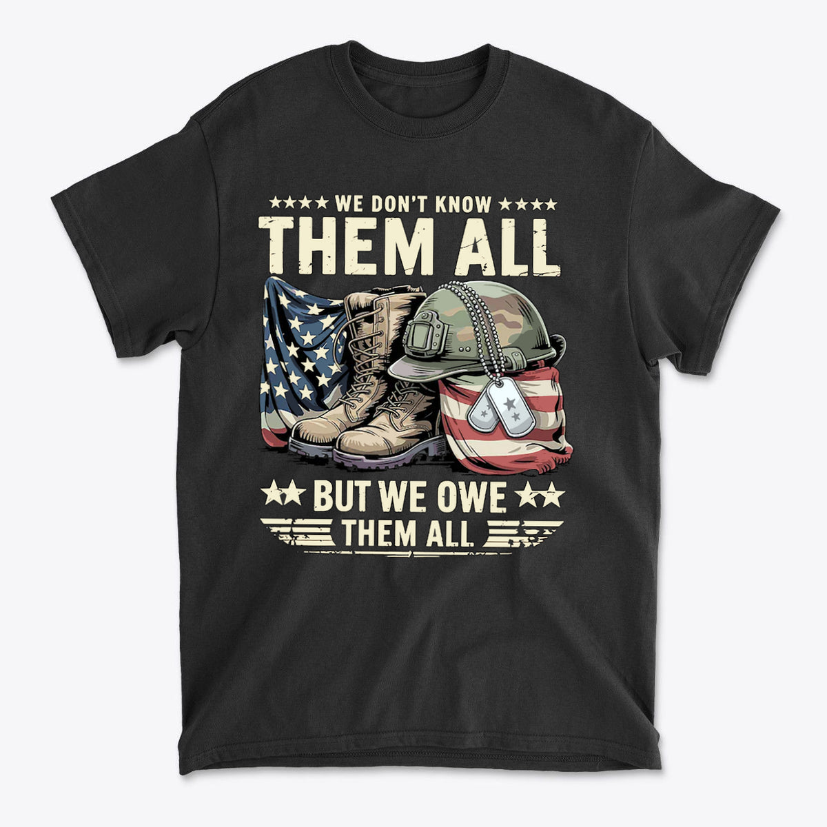 We Don't Know Them All But We Owe Them All graphic t-shirt featuring military boots, dog tags, and an American flag.