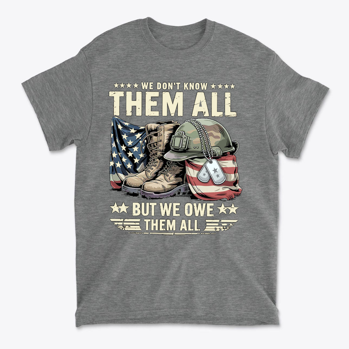 We Don't Know Them All But We Owe Them All graphic t-shirt featuring military boots, dog tags, and an American flag design.