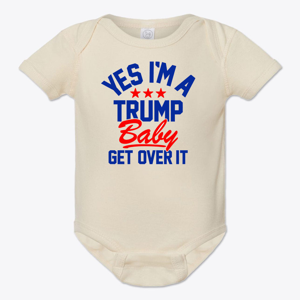 Yes I am A Trump Baby Onesie Art featuring text 'YES I'M A TRUMP Baby GET OVER IT' on a cream background.