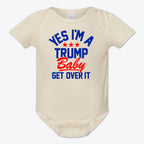 Yes I am A Trump Baby Onesie Art featuring text 'YES I'M A TRUMP Baby GET OVER IT' on a cream background.