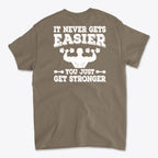 Back Print Never Gets Easier Fit graphic tee featuring motivational text about strength.