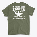 Back Print Never Gets Easier Fit shirt featuring motivational text on a green background.