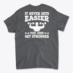Back Print Never Gets Easier Fit graphic tee showcasing motivational quote on the back.