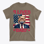 Nine Lives Baby Red Letters Art graphic tee featuring a cat in a suit against a flag background.