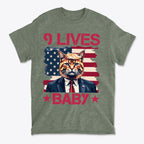 Nine Lives Baby Red Letters Art graphic tee featuring a cat in a suit against an American flag background.