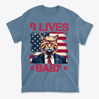Nine Lives Baby Red Letters Art graphic tee featuring a cat in a suit against an American flag background.