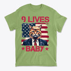 Nine Lives Baby Red Letters Art graphic tee featuring a cat in a suit against an American flag background.