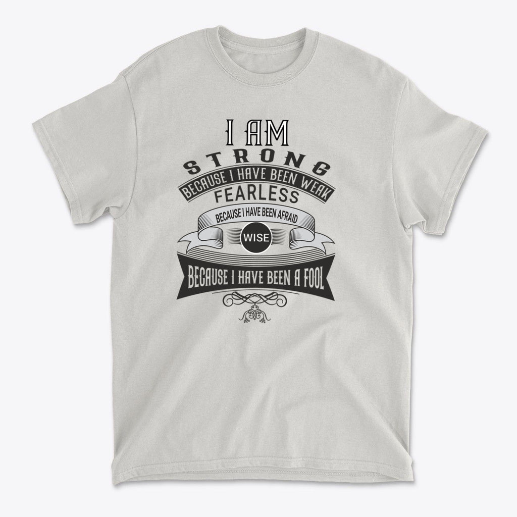 Strength Born From Past Weakness graphic t-shirt featuring a motivational message about strength and wisdom.