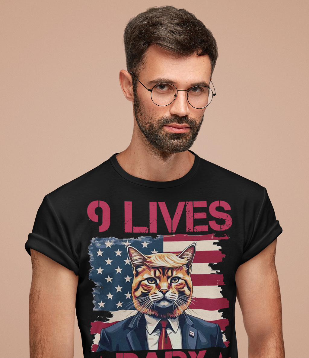 Nine Lives Baby Red Letters Art graphic tee featuring a cat in suit. Patriotic design for conservative supporters.