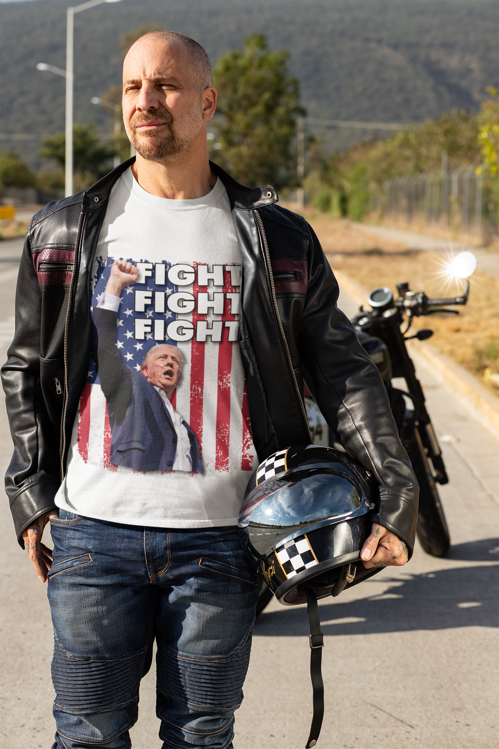 Man wearing Fight Fight Fight Bold Logo Tee with a motorcycle in the background, showcasing patriotism and conviction.
