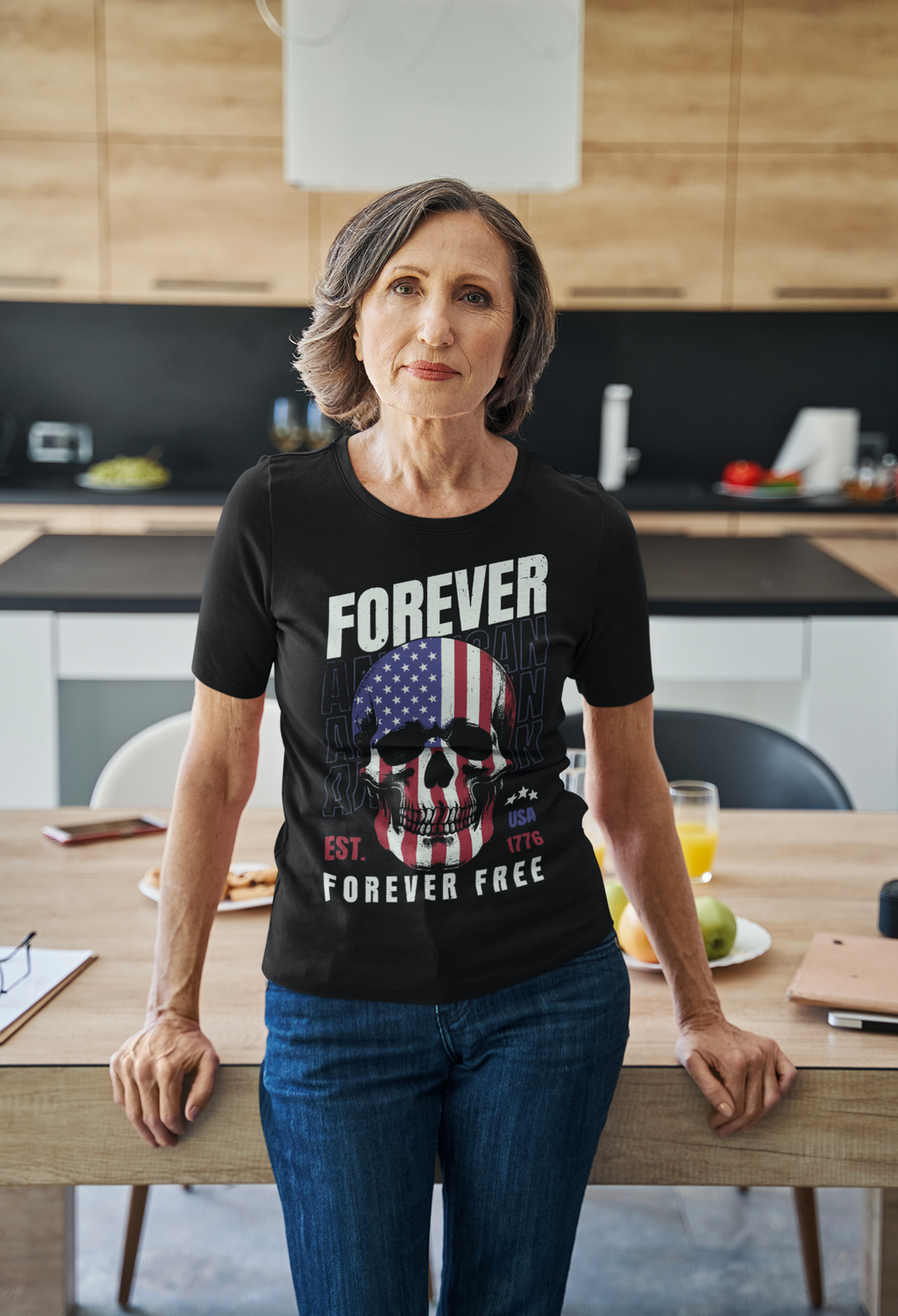 Woman wearing Forever Free American Pride Shirt in a kitchen, showcasing patriotic design with skull and American flag.