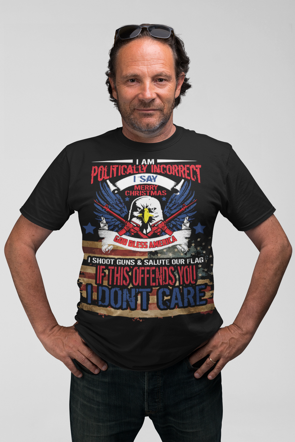 Man wearing 'God Bless America Patriotic Christmas Design' t-shirt with eagle and flag graphics, promoting conservative values.