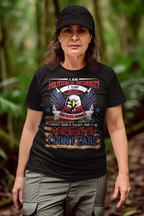 Woman wearing "God Bless America Patriotic Christmas Design" t-shirt with bold conservative message, standing outside.