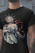 Marilyn Statue Of Liberty Apparel featuring a woman in a robe holding a weapon, showcased on a black t-shirt.