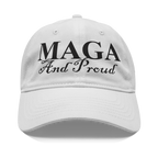 MAGA And Proud Black Script Tee displayed on a white cap, showcasing patriotism and personal values.