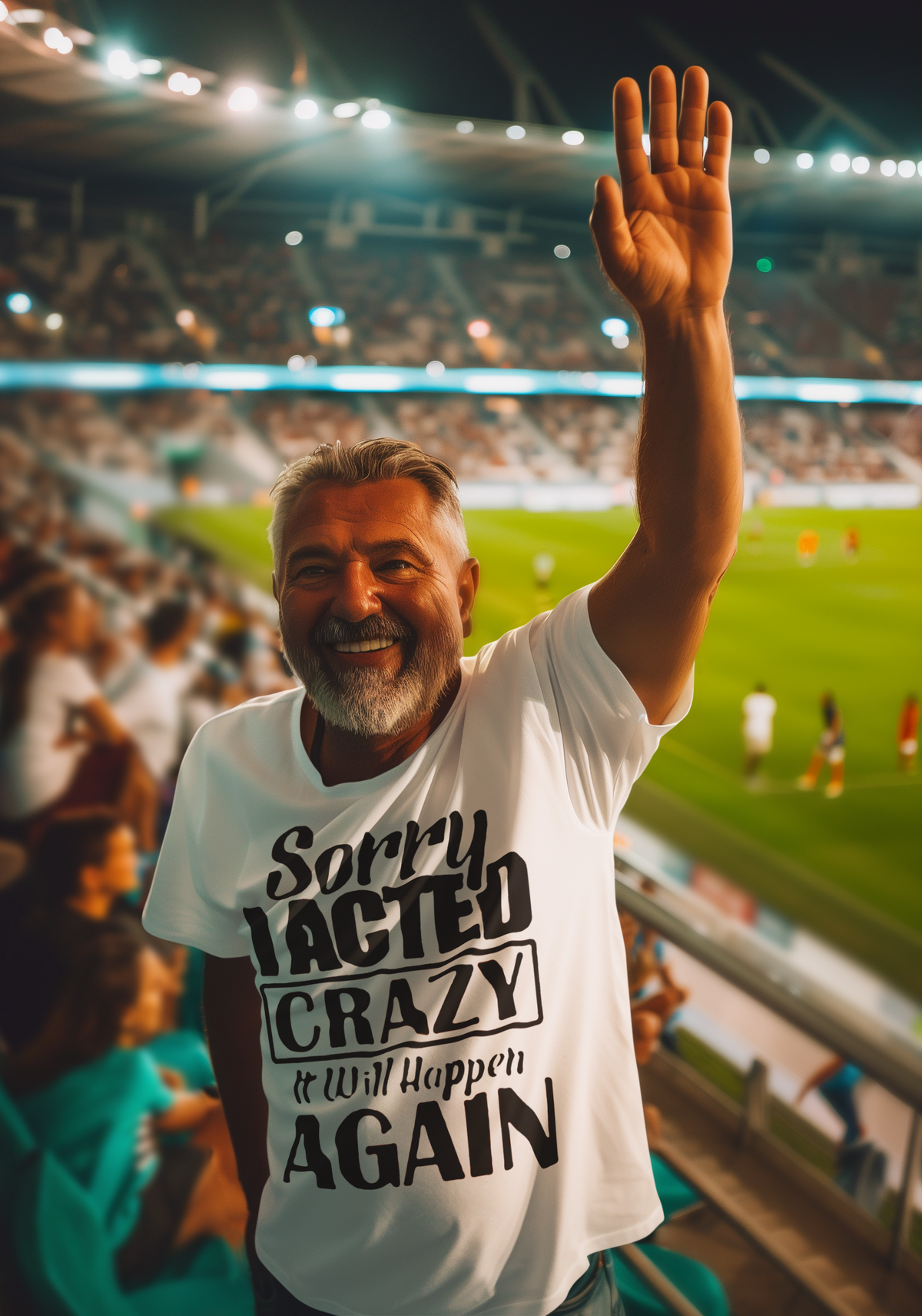 Man smiling at a stadium wearing "Sorry I Acted Crazy Funny Statement Tee" raising his arm.
