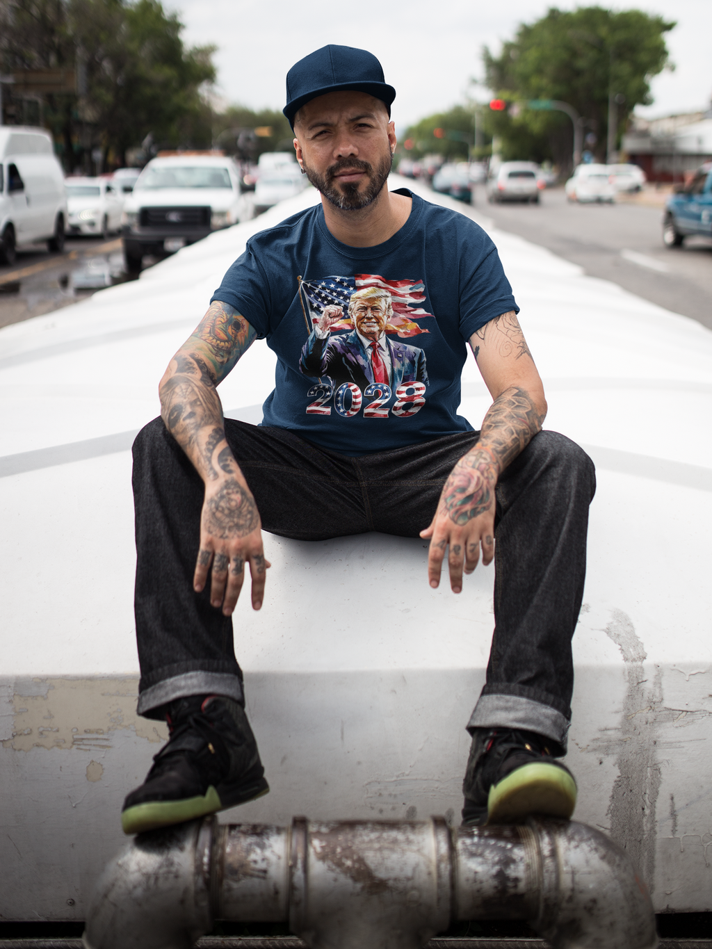 Man wearing Trump 2028 Raised Fist Print Tee against urban backdrop, showcasing premium conservative graphic t-shirt.
