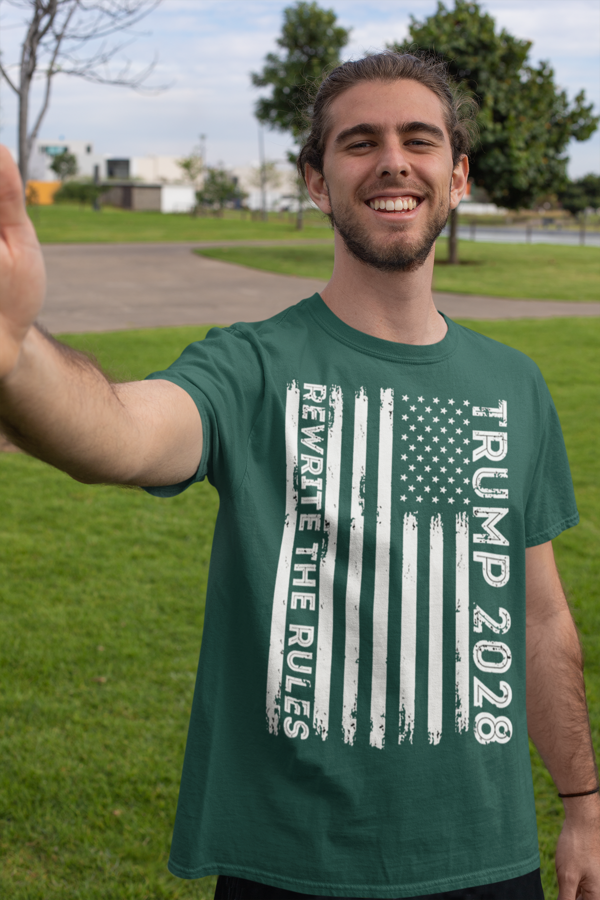 Trump 2028 Rewrite The Rules On Vertical American Flag apparel worn by a smiling man outdoors.