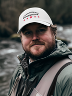 Unapologetically Conservative - Foam Mesh-Back Trucker Cap worn by a man by the river, showcasing a conservative message.