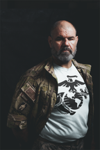 USMC Eagle Globe Graphic Design featured on a premium t-shirt worn by a man in military attire