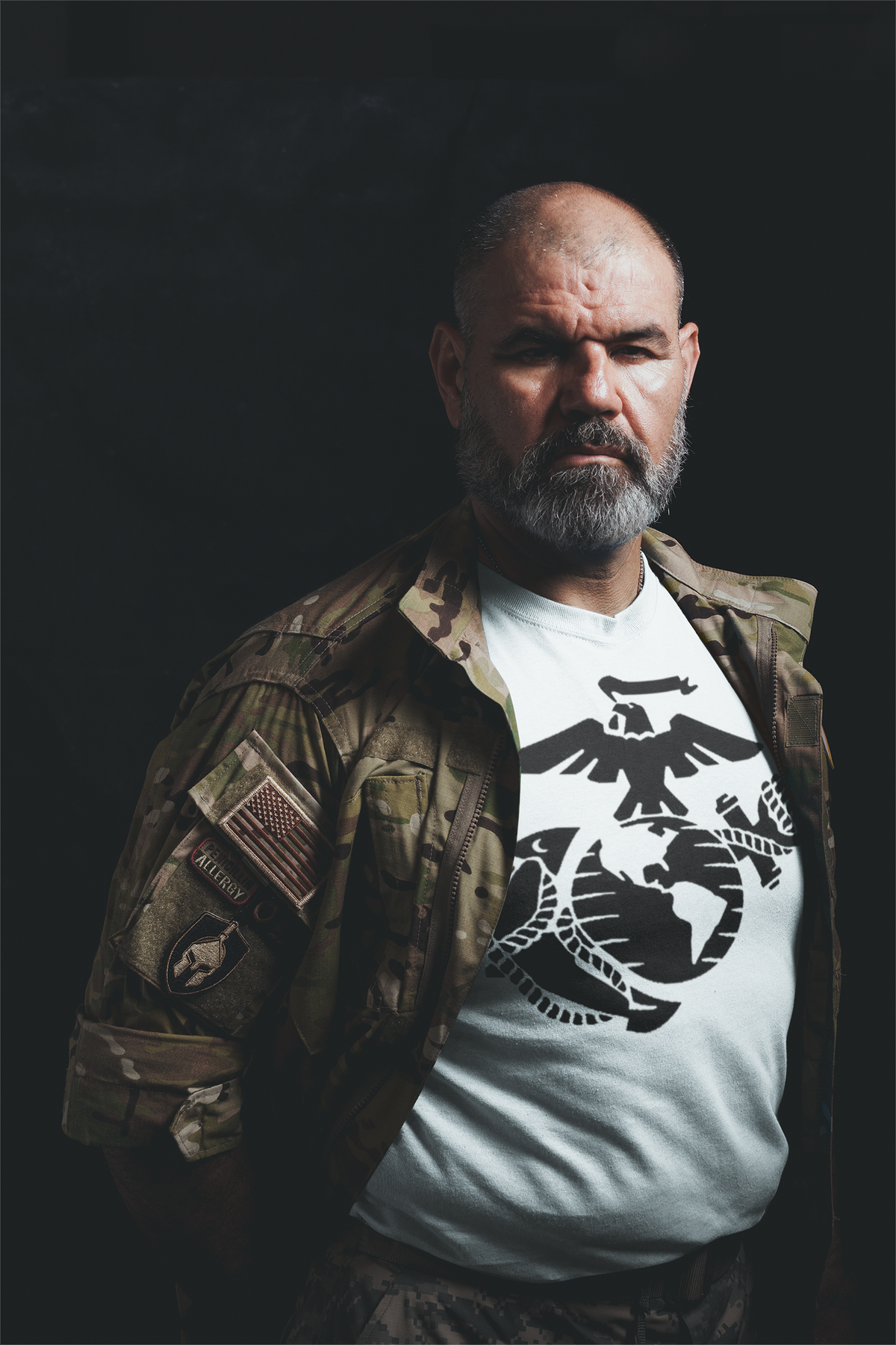 USMC Eagle Globe Graphic Design featured on a premium t-shirt worn by a man in military attire
