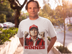 Man wearing Trump The Winning Choice Apparel t-shirt with a winner graphic and raised fists, showcasing conservative support.