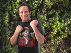 Man wearing Trump The Winning Choice Apparel t-shirt, celebrating a conservative message in a vibrant outdoor setting.