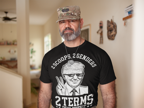 Man wearing a graphic tee reading '2 Scoops 2 Genders Two Terms Deal With It' in a casual setting.