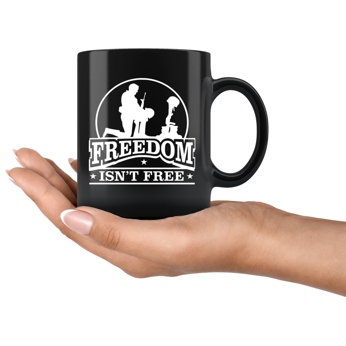 Hand holding Freedom Isn't Free Patriotic Graphic Tee mug with silhouette design.