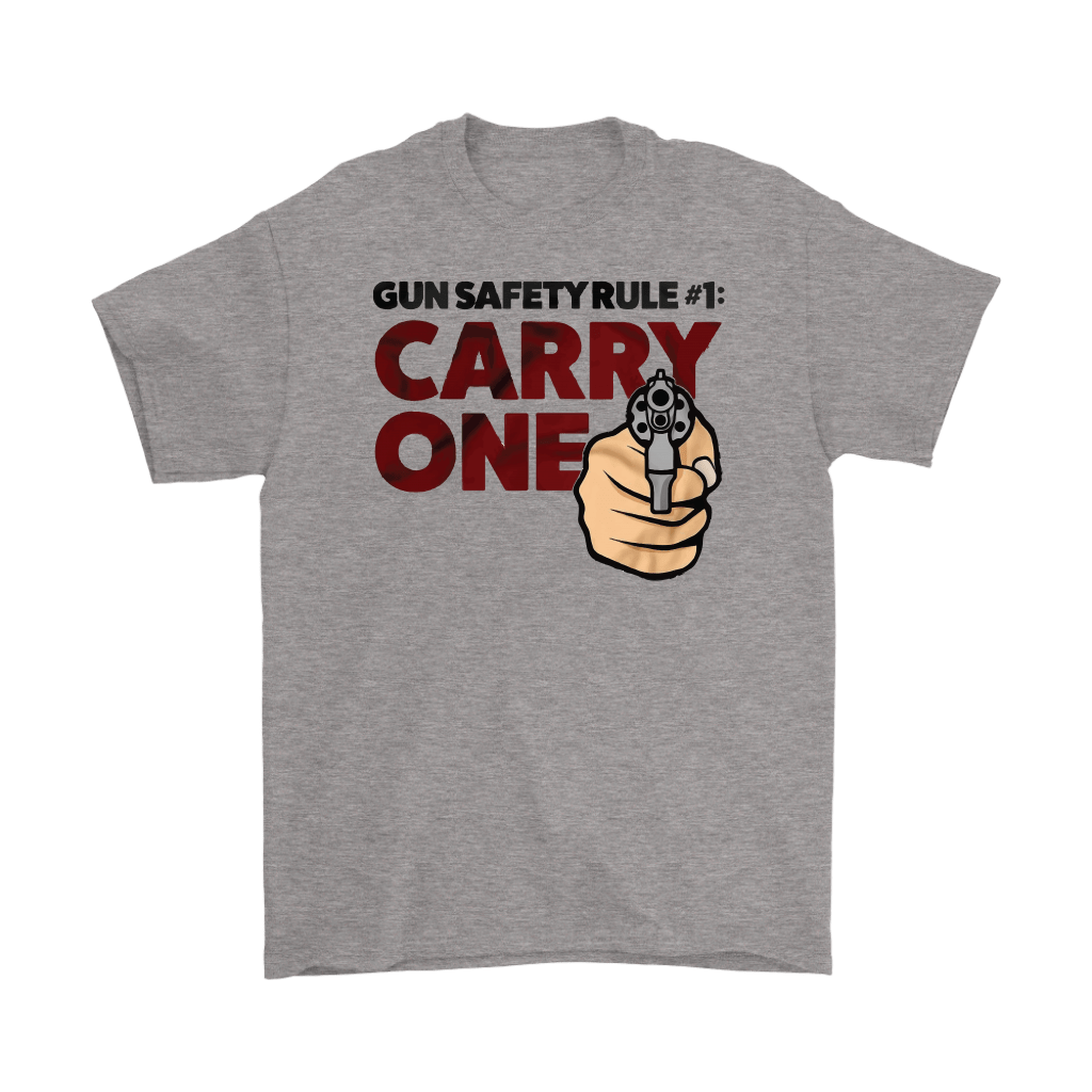 Gray graphic t-shirt featuring Gun Safety Rule Always Carry One text with a hand pointing a revolver