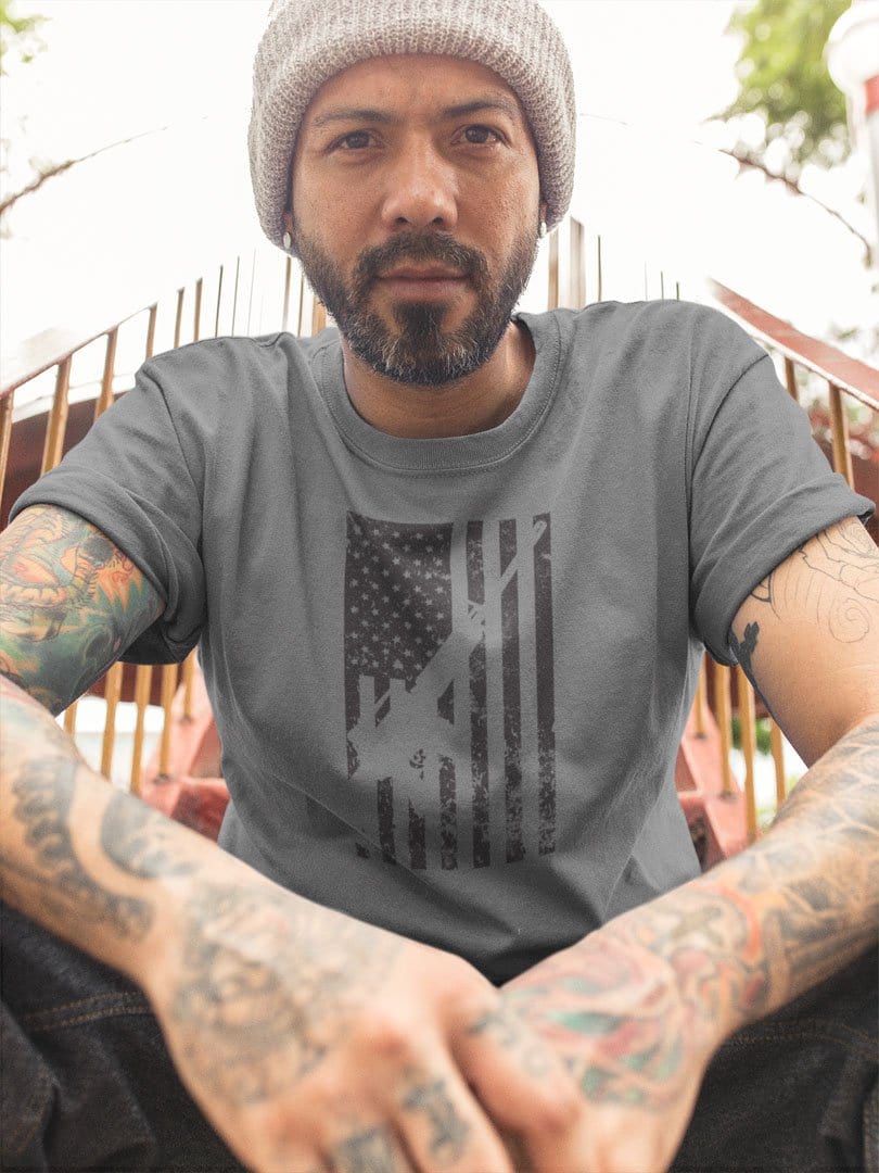 Man wearing a t-shirt with American Flag With AR-15 Silhouette design