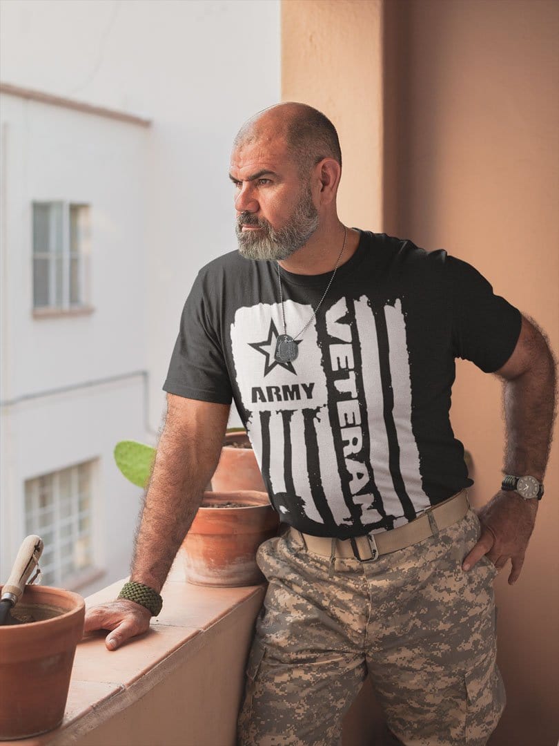 Man wearing Army Veteran Flag With Soldier Silhouette shirt standing on balcony