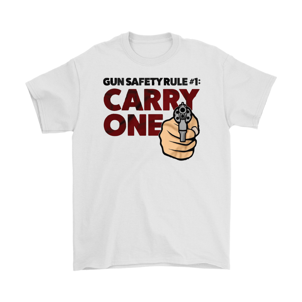 Gun Safety Rule Always Carry One graphic t-shirt with bold text and gun design on a white background.