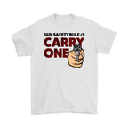 Gun Safety Rule Always Carry One graphic t-shirt with bold text and gun design on a white background.