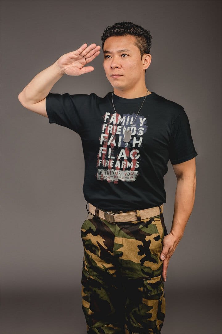 Man saluting in camo pants wearing "Family Friends Faith Flag Values Matter Tee"