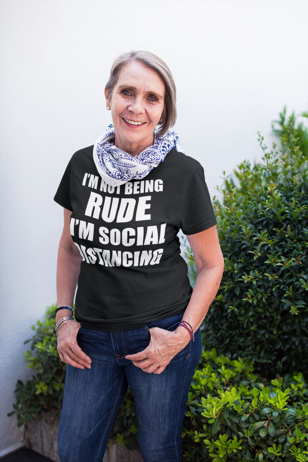 Woman wearing I'm Not Being Rude I'm Social Distancing shirt, casual streetwear.