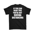Black T-shirt with text "If You Can Read This You're Not Social Distancing On Back" in bold white letters.
