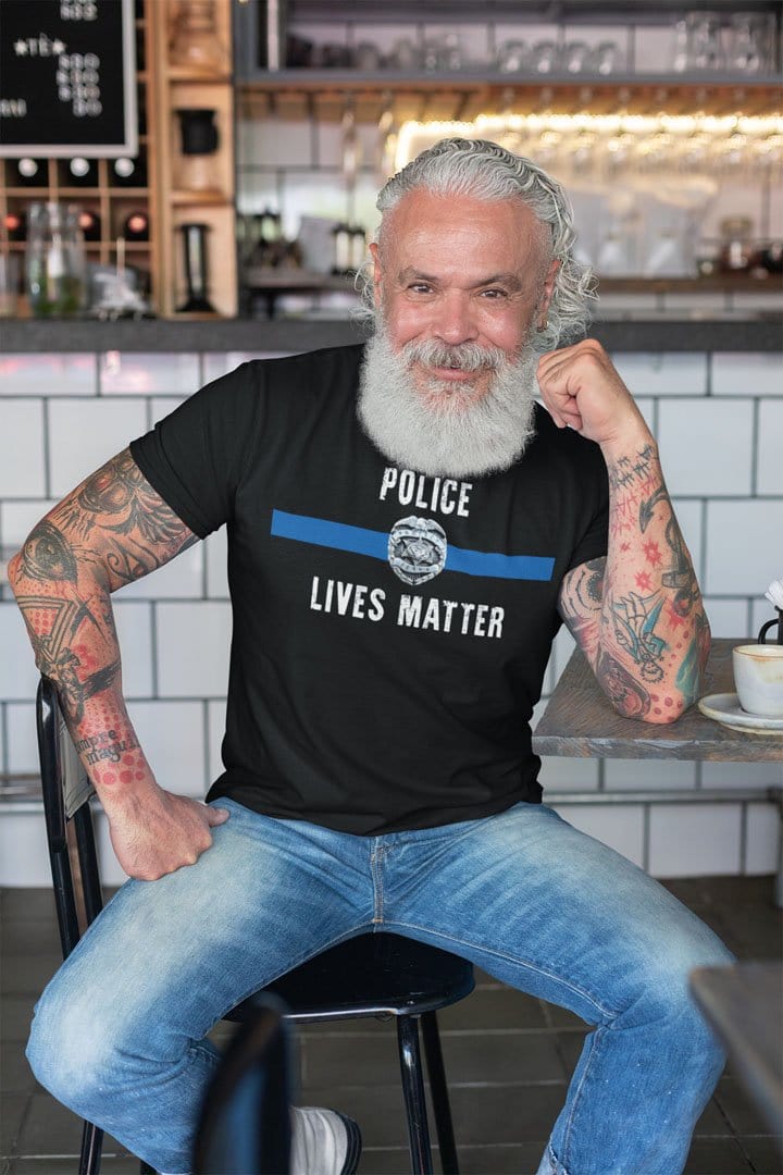 Man wearing Police Lives Matter With Badge t-shirt sitting in a cafe