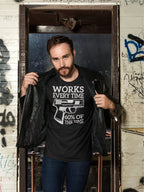 Sixty Percent Of The Time It Works graphic t-shirt modeled by man in urban setting.