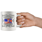 Hand holding a mug with American By Birth Southern By The Grace Of God Wht design, featuring American and Southern flags.