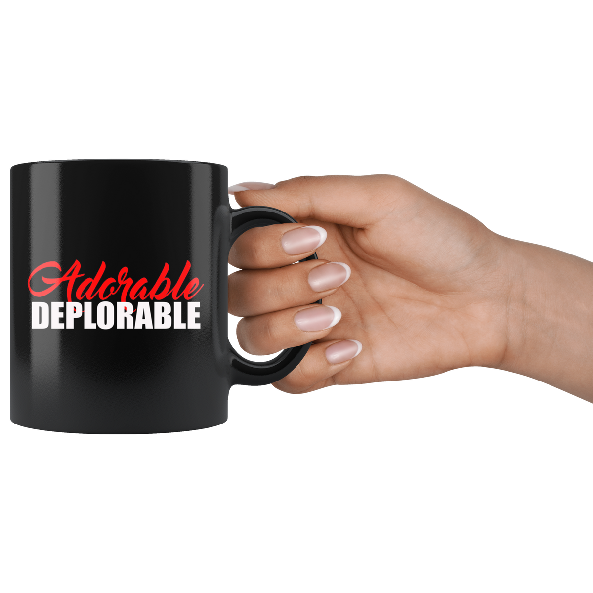 Hand holding an Adorable Deplorable Coffee Cup, black ceramic mug with white and red text, perfect for hot and cold drinks.
