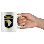 Hand holding mug with Airborne Eagle Symbol Patriotic Graphic
