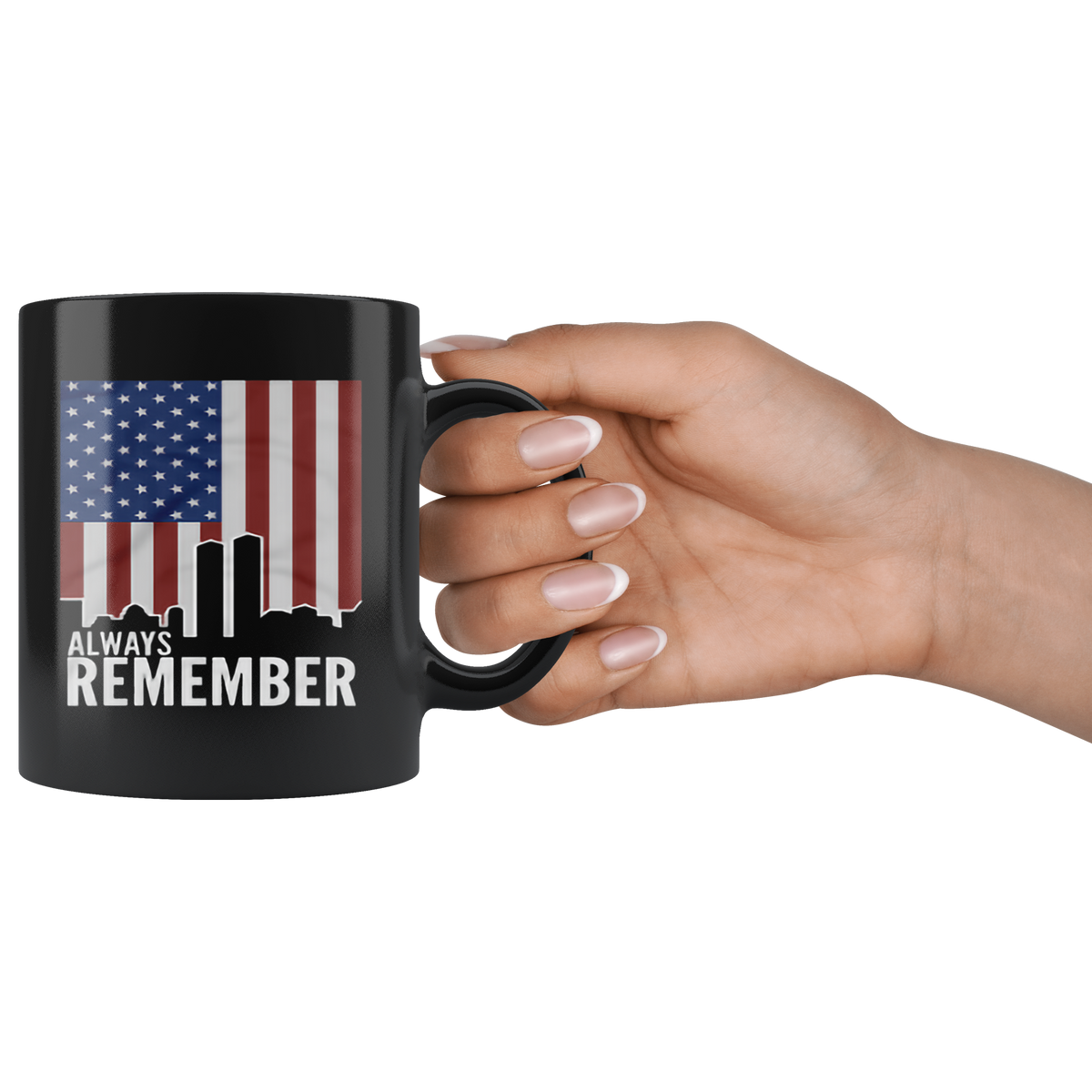 Black ceramic mug with 'Always Remember Twin Towers On American Flag' design, held in hand, perfect for hot and cold beverages.