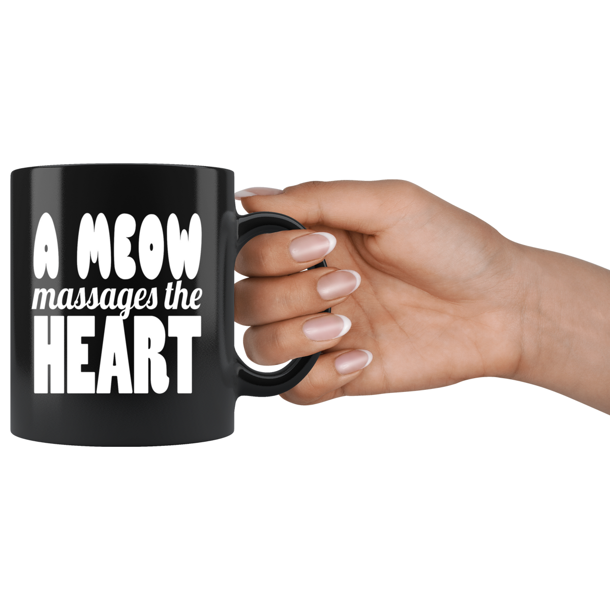 Ceramic black mug with "A Meow Massages the Heart Graphic Print" held in a hand, showing vibrant text design.