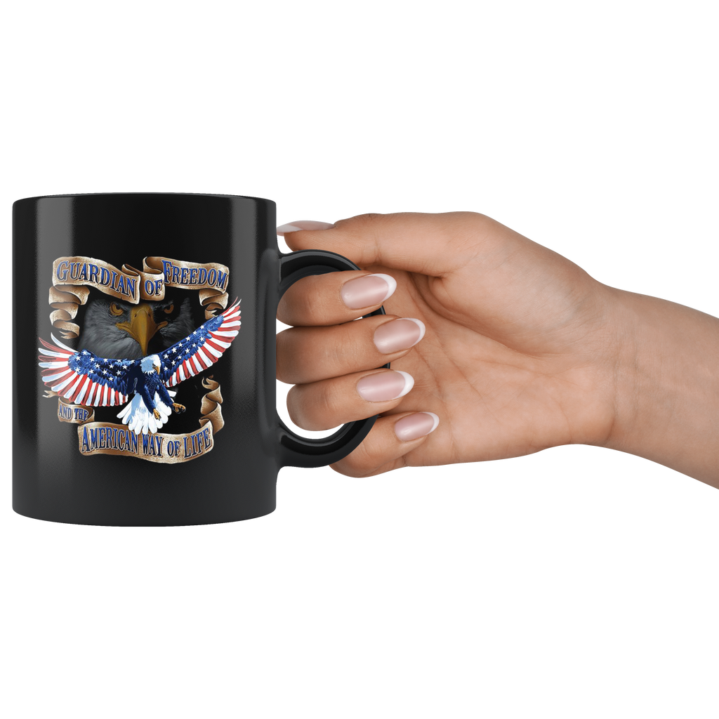 Guardian Of Freedom And The American Way Of Life Cup held in hand, black ceramic mug with eagle design