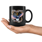 Hand holding a Guardian Of Freedom And The American Way Of Life Cup with American eagle design.